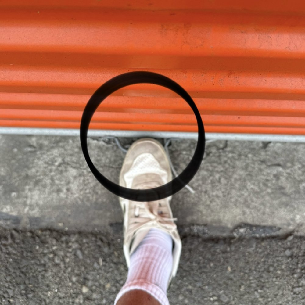 Pull the handle down and press the bottom bar to the floor with your foot. Make sure it’s flat and fully touching the ground.